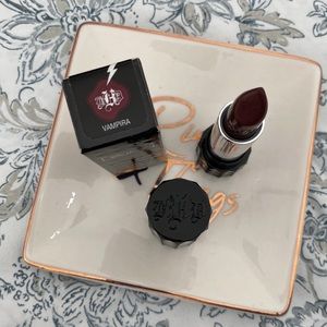 is a slightly warm-toned, dark burgundy with a satin finish permanent lipstick